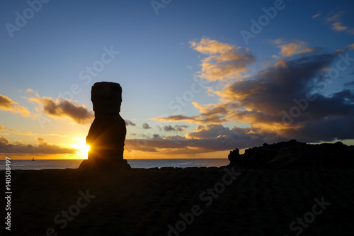 Moai statue ahu akapu at sunset, easter island photo