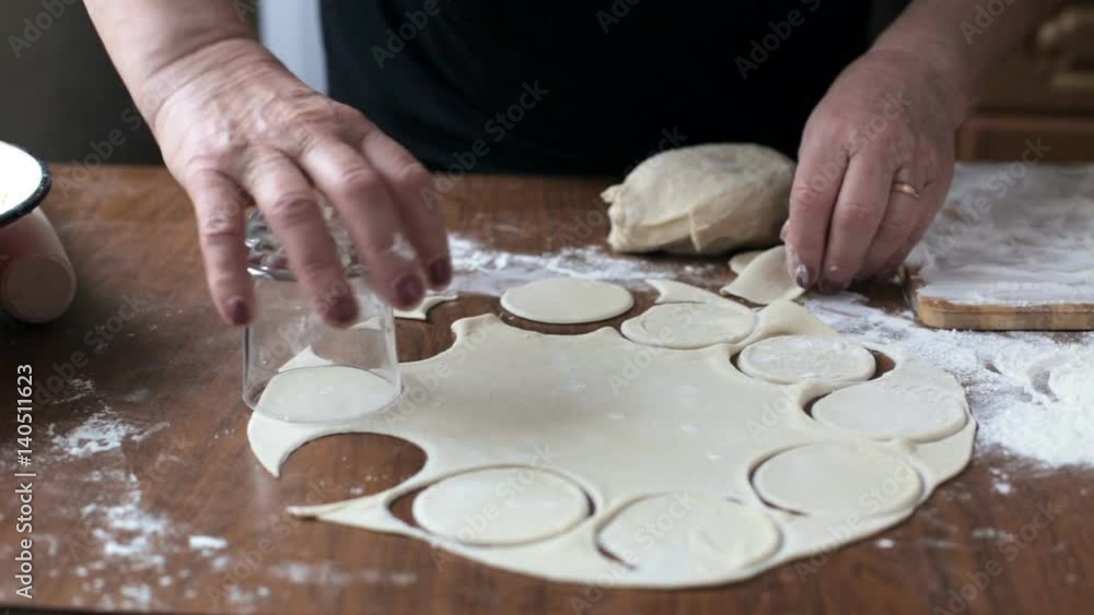 Old woman modeling dumplings Old woman modeling dumplings