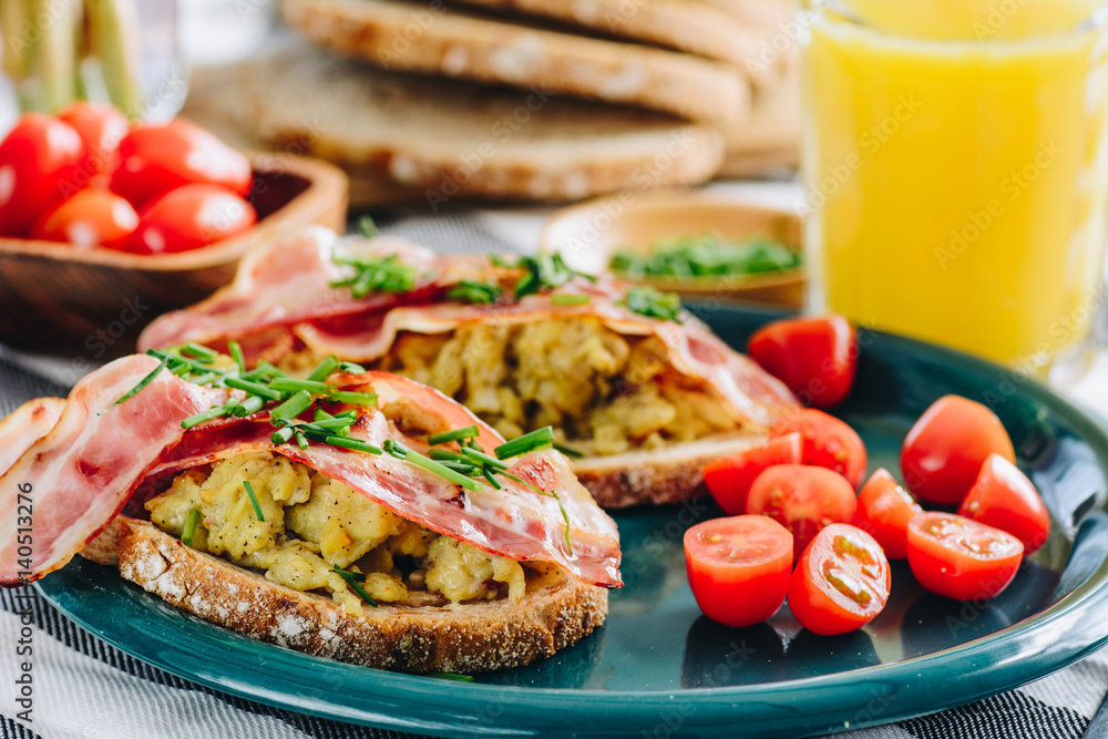 Sandwiches with scrambled eggs and bacon