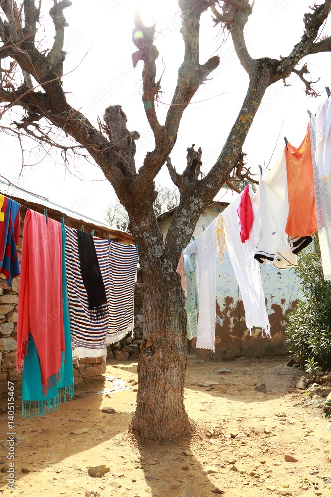 Clothes hanging to dry in the sun in a traditional way