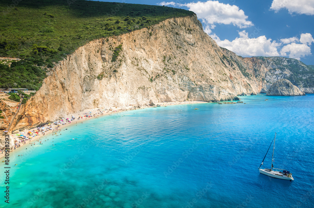 Porto Katsiki beach in Lefkada island, Greece. Luxury yacht on a blue sea.
