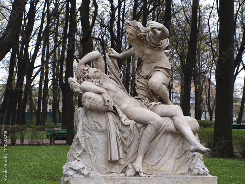 Marble statue of amour and psyche sculpture at Letniy sad park in Saint-Petersburg, Russia photo