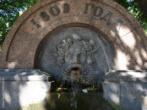 Fountain drinking bowl in Voronikhin Garden in Saint-Petersburg, Russia photo