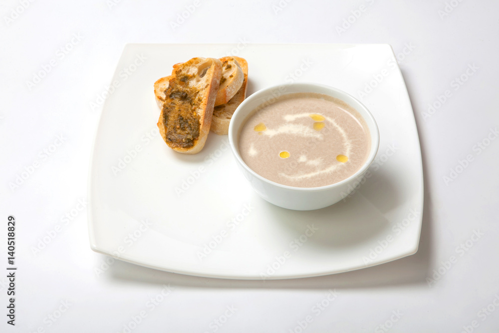 Soup puree mushrooms in a deep white plate Soup puree mushrooms in a deep white plate