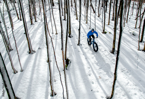 Fat biker riding in the snow photo