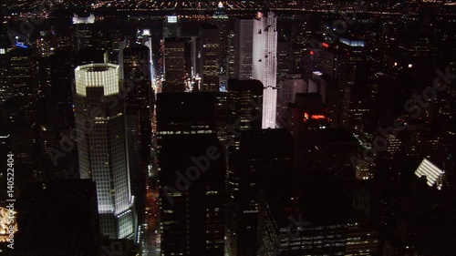 Night flight over midtown Manhattan skyscrapers. Shot in 2005.