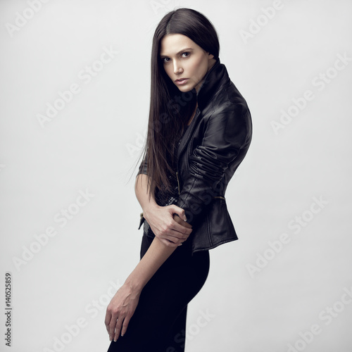 Fashion beauty portrait of a young beautiful sensual model with long straight brown hair.