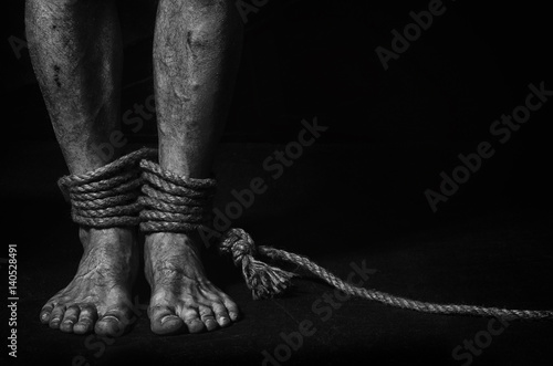 A man with bound legs. photo