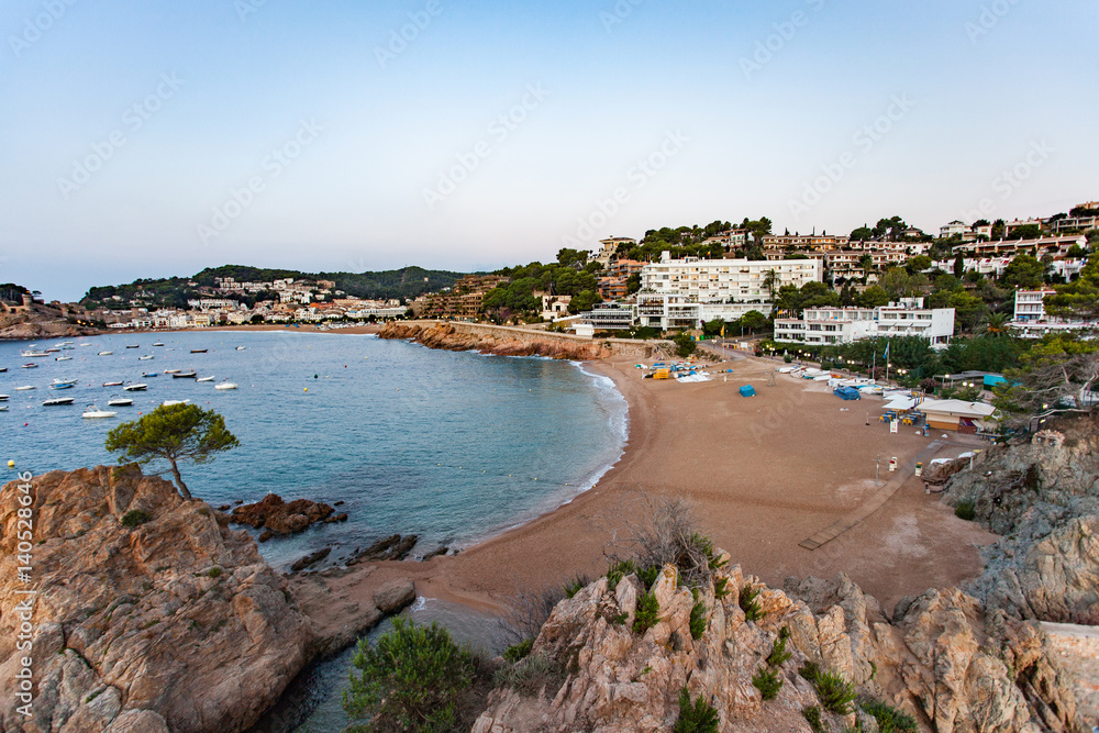 View of a small beach and coastline in Tossa del Mar in the early morning
