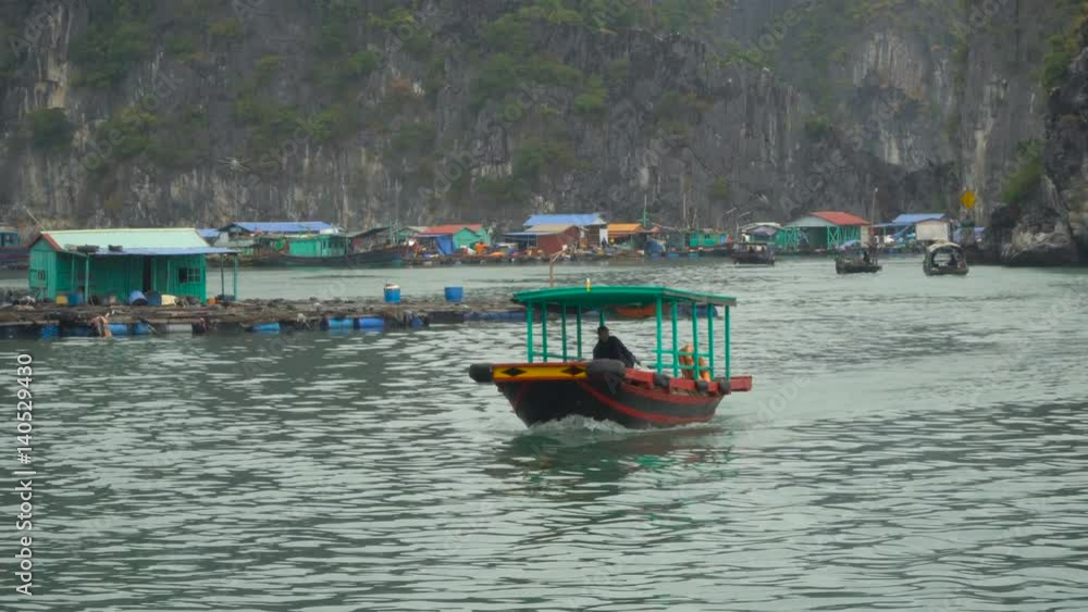 Vietnamese fishing boat sails on the sea. Asian region. South China Sea. Vietnam travel landscape and destinations. Vietnamese fishing boat sails on the sea. Asian region. South China Sea. Vietnam travel landscape and destinations.