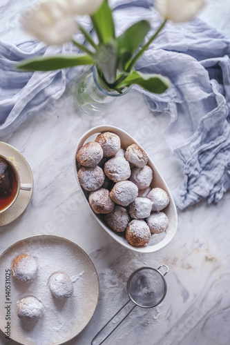 Castagnole, Italian sweet fritters in a white bowl photo