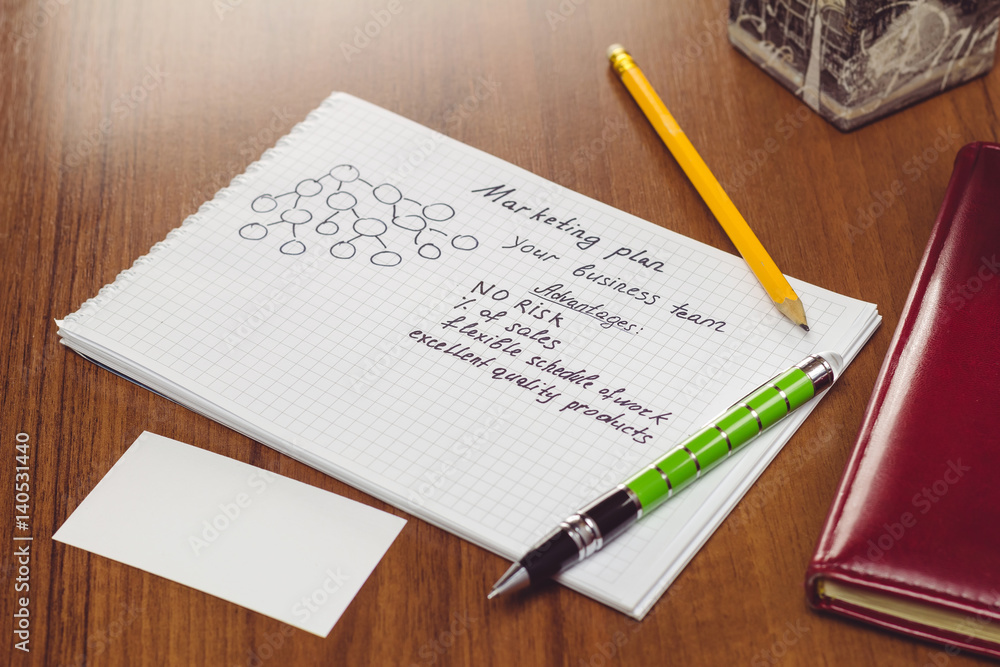 Presentation of business concepts network marketing and business structures diagram, advantages in notepad on the table. Presentation of business concepts network marketing and business structures diagram, advantages in notepad on the table.