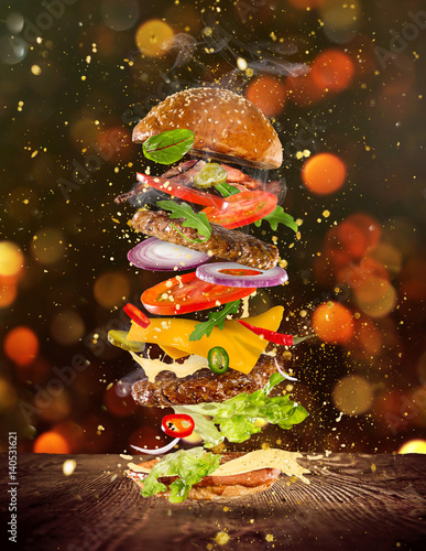 Big tasty burger with flyin...
