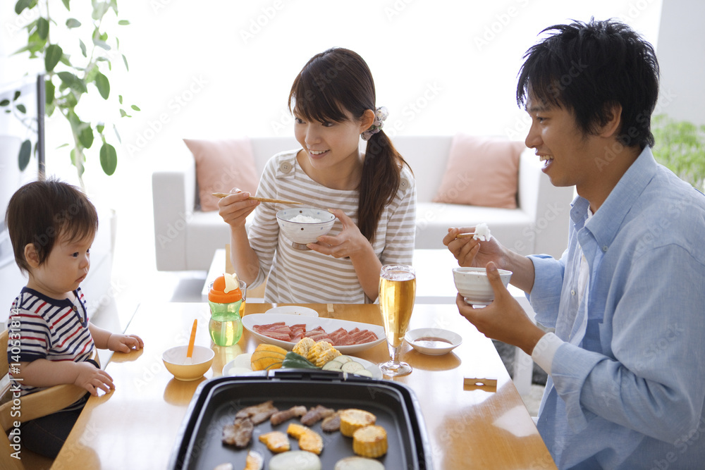 Parents and Baby Boy Having Dinner