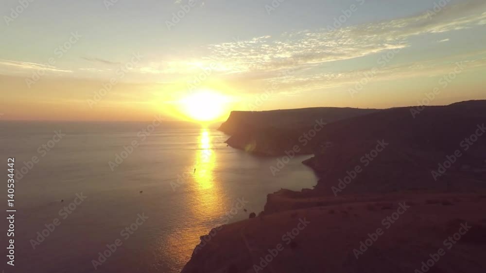 Aerial of sunset. Timelapse sunrise in the mountains. Bike riders. Sea coast. Cave city Mangup-Kale, Crimea. Plateau. Aerial of sunset. Timelapse sunrise in the mountains. Bike riders. Sea coast. Cave city Mangup-Kale, Crimea. Plateau.
