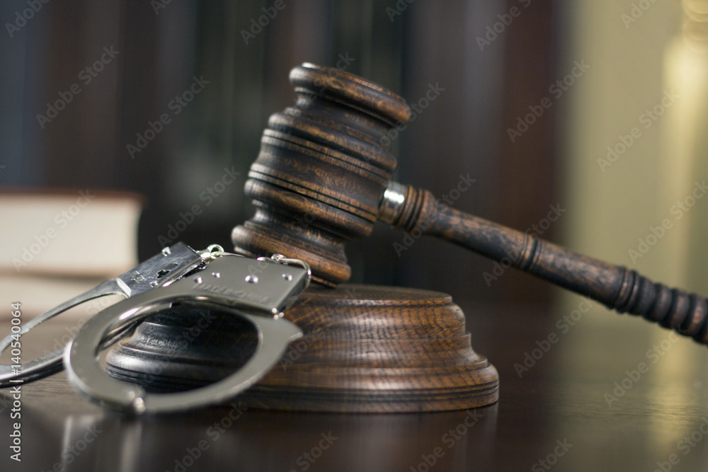 Law theme Judge mallet and Handcuffs in court Law theme Judge mallet and Handcuffs in court