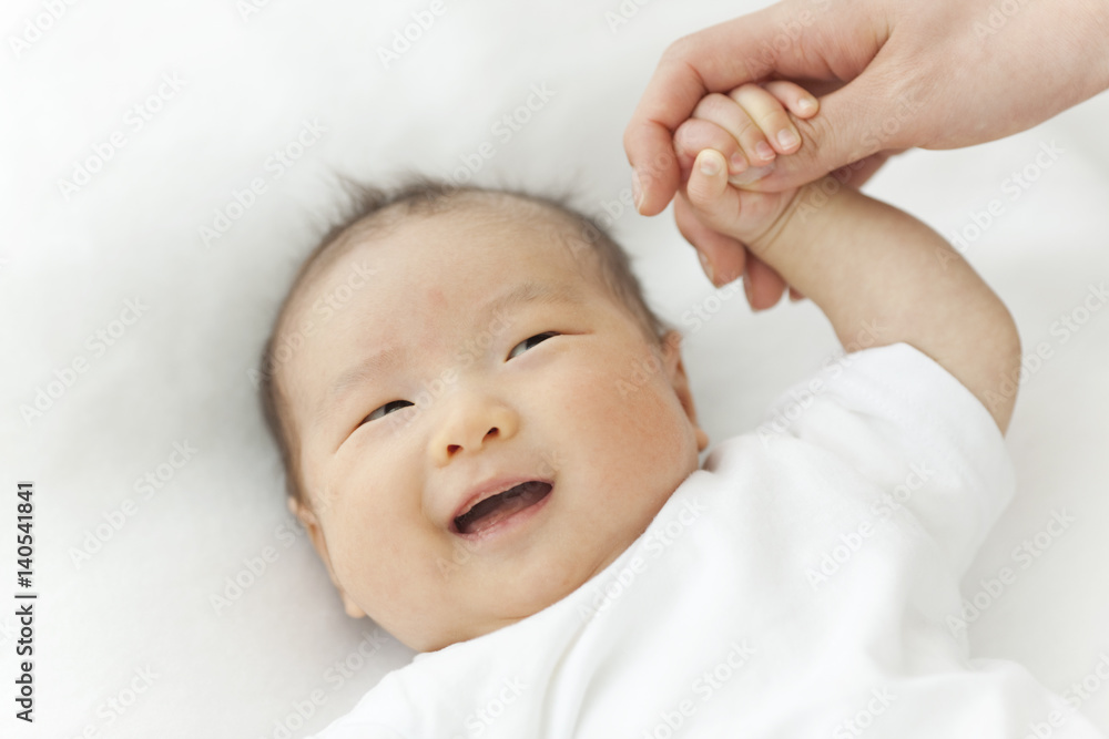 Mother Holding Baby's Hand