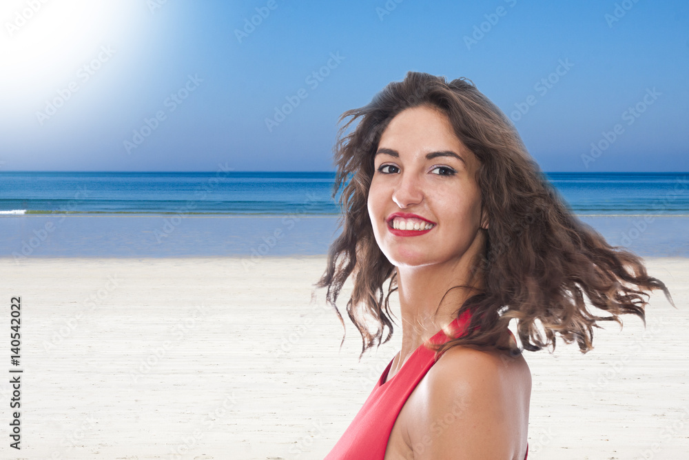 portrait of smiling young woman on the beach portrait of smiling young woman on the beach
