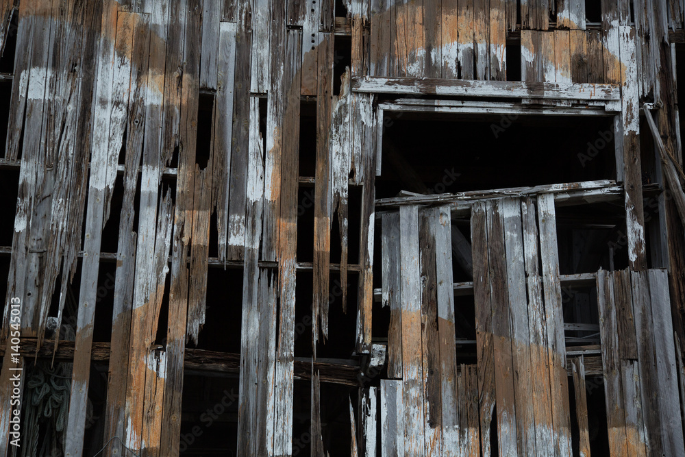 wooden texture of old fisherman shed on the sea shore