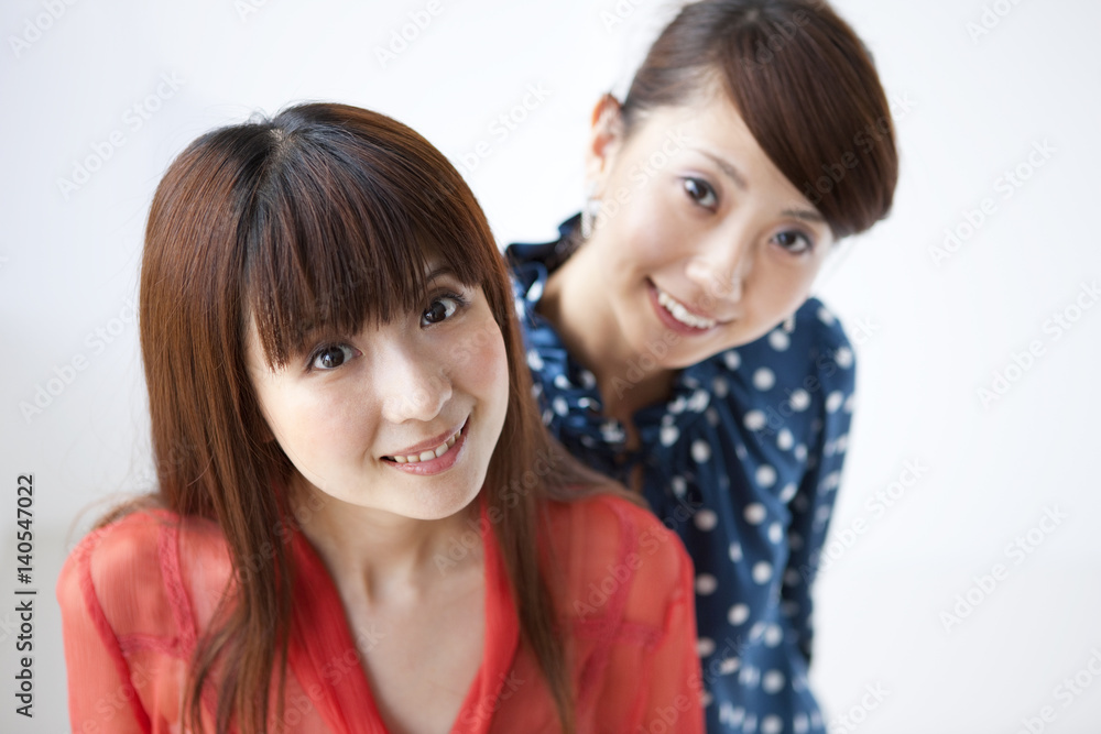 Portrait of young women, smiling, white background Portrait of young women, smiling, white background