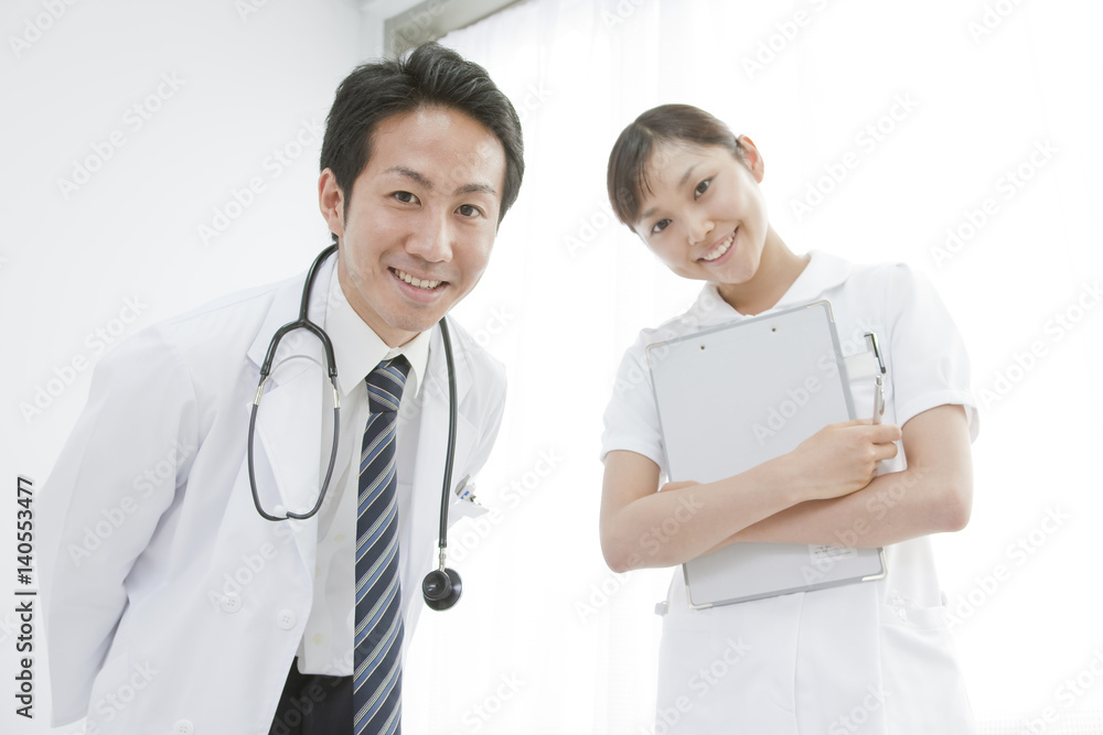 Portrait of male doctor and nurse standing against white background Portrait of male doctor and nurse standing against white background