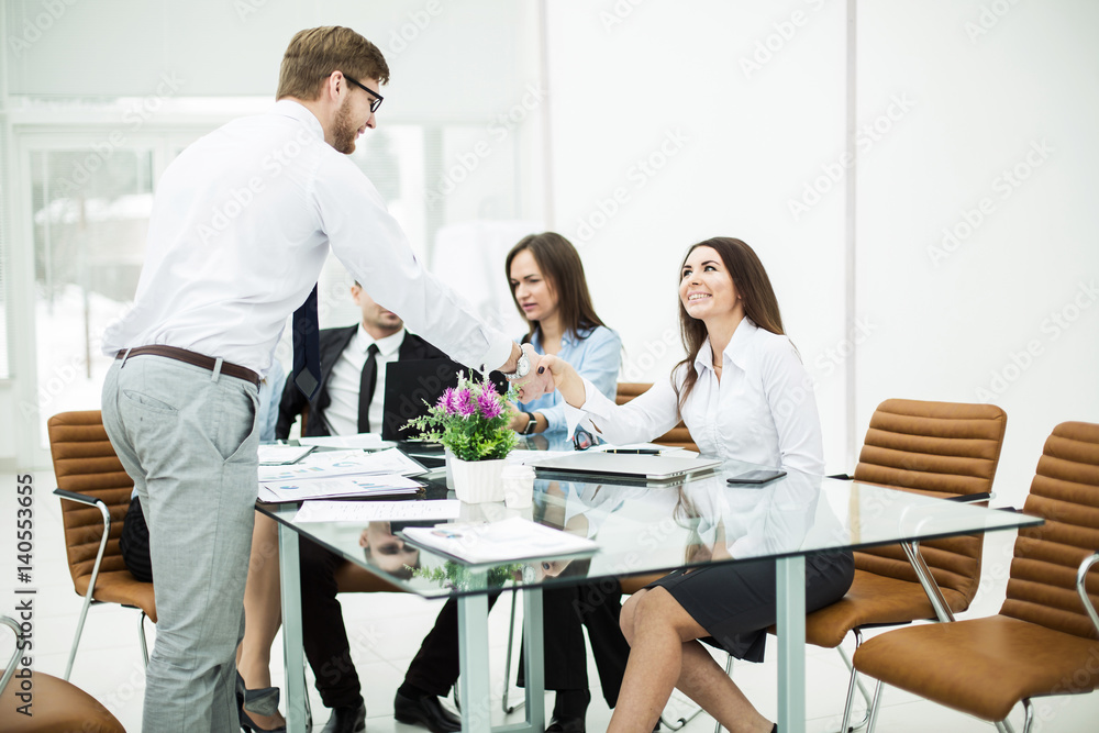 handshake Manager and the client at a business meeting in the office handshake Manager and the client at a business meeting in the office