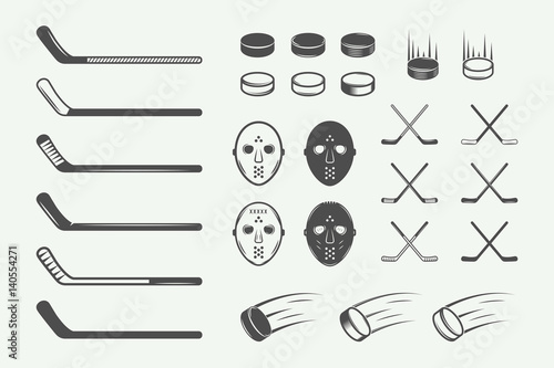 Set of vintage hockey elements in retro style. Puck, hockey stick, flying puck. Graphic Art. Vector Illustration.