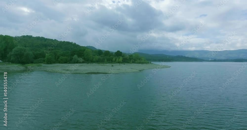 Aerial shot Sea coast in Tuscany in gloomy weather, water transport is on the seashore Aerial shot Sea coast in Tuscany in gloomy weather, water transport is on the seashore