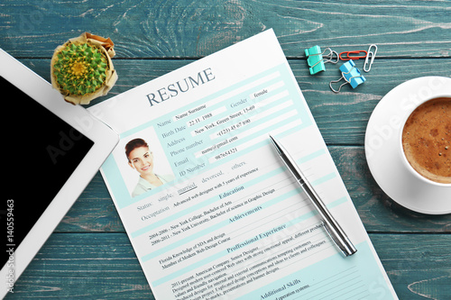 Workplace with resume, tabl...