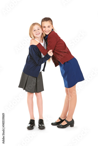 Two cute girls in school un...
