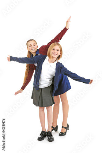 Two cute girls in school un...