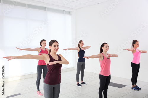 Fototapeta Naklejka Na Ścianę i Meble -  Young sporty women training in dance hall