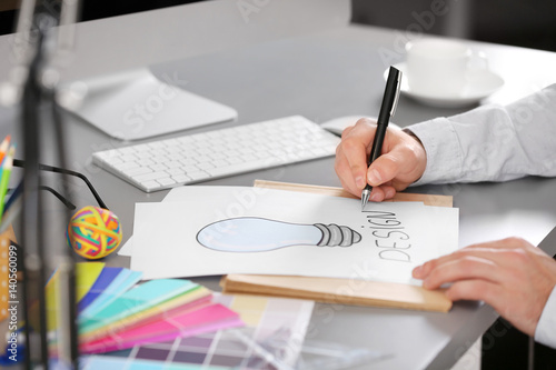 Male designer working in of...