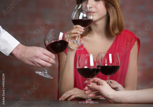 People with wine glasses at restaurant