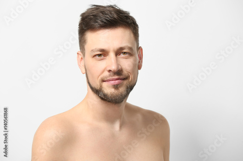 Handsome young man posing on white background