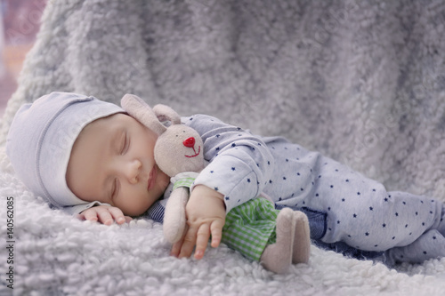 Cute little baby with bunny...