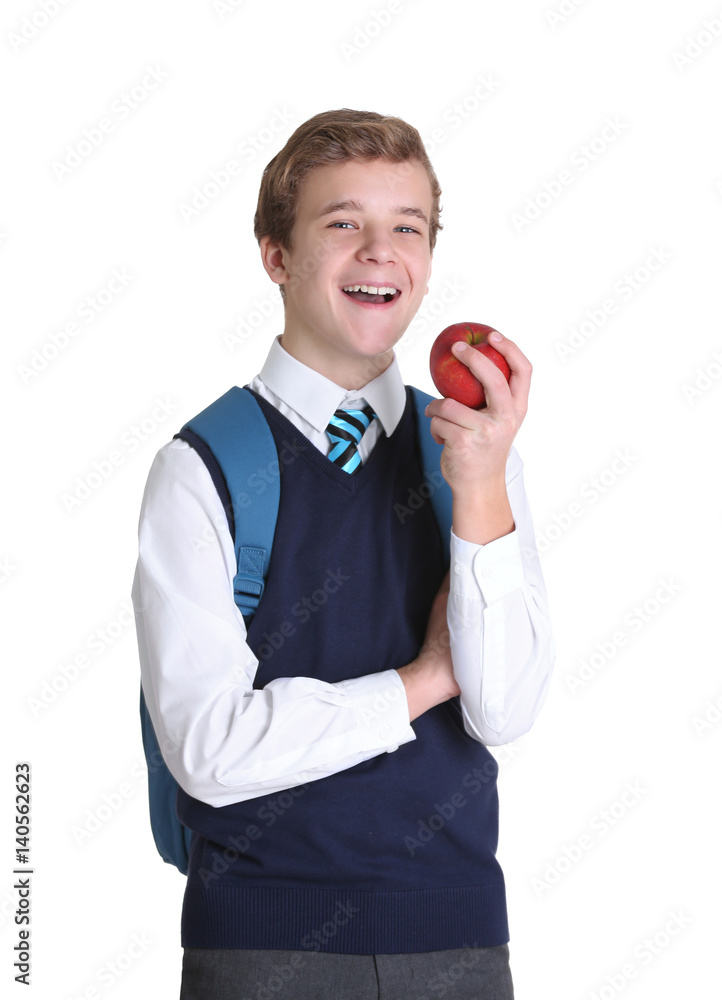 Cute schoolboy with apple on white background Cute schoolboy with apple on white background