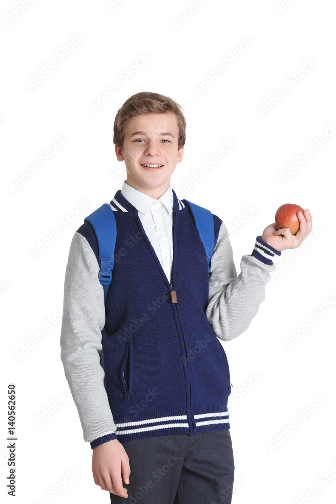 Cute schoolboy with apple on white background Cute schoolboy with apple on white background