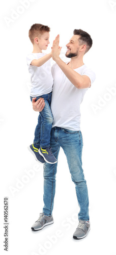 Handsome man with his son on white background