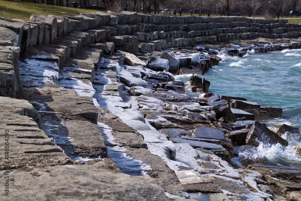 Fototapeta premium Ice covered, frigid Lake Michigan shoreline in Chicago south side park.