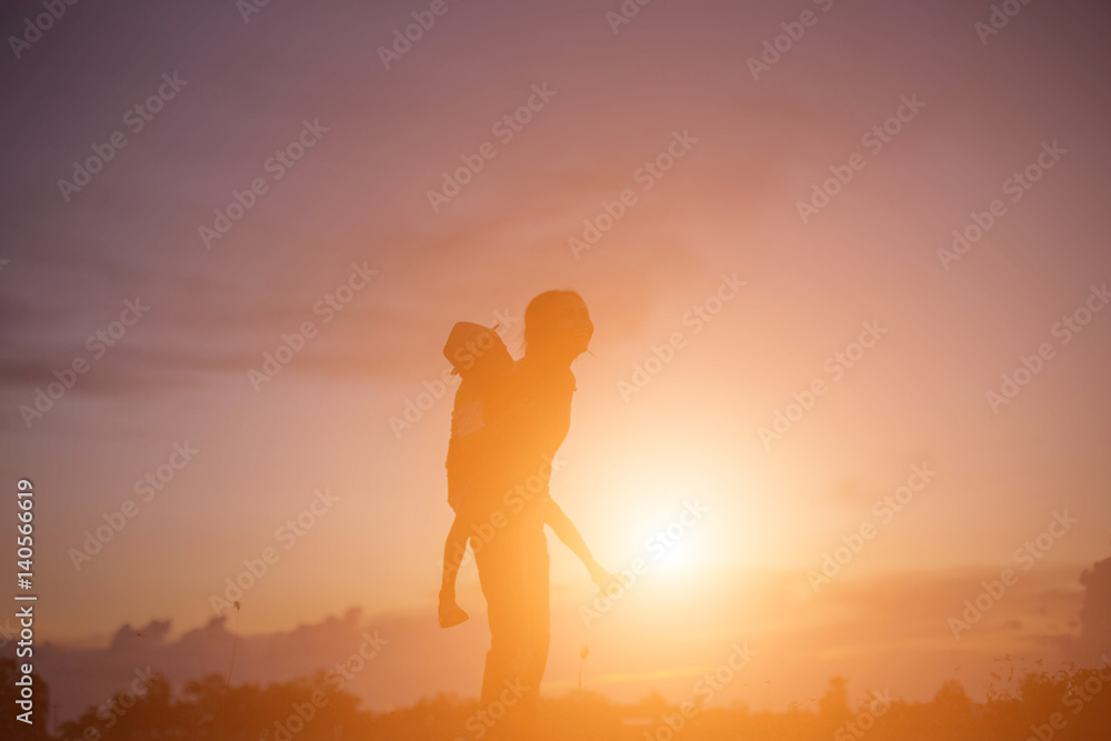 silhouette of a happy children and happy time sunset 