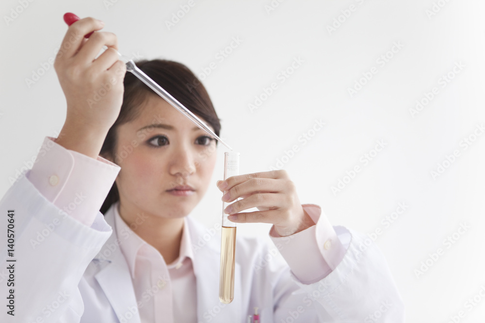 Female Scientist Filling Test Tube Female Scientist Filling Test Tube