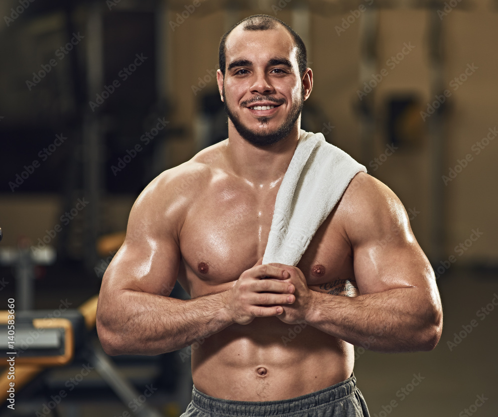 Fototapeta premium smilimg athlete with towel