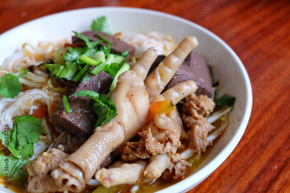 “Kanom Jeen Nam Ngeaw” Rice noodles with spicy pork sauce and Chicken foot. Local food in Northern Thailand. “Kanom Jeen Nam Ngeaw” Rice noodles with spicy pork sauce and Chicken foot. Local food in Northern Thailand.