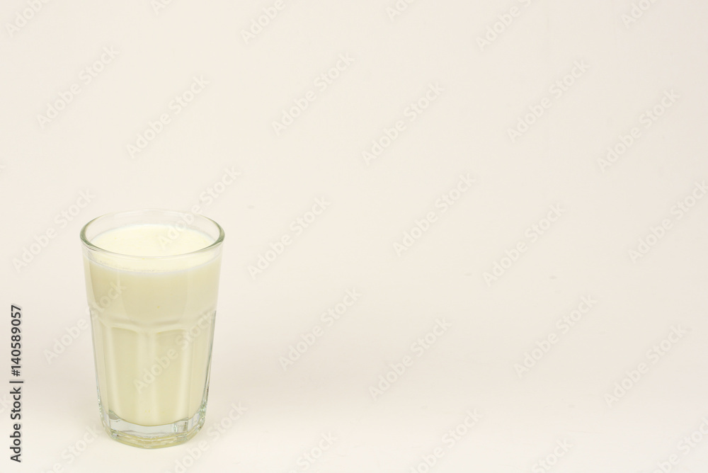 A glass of milk over white background A glass of milk over white background