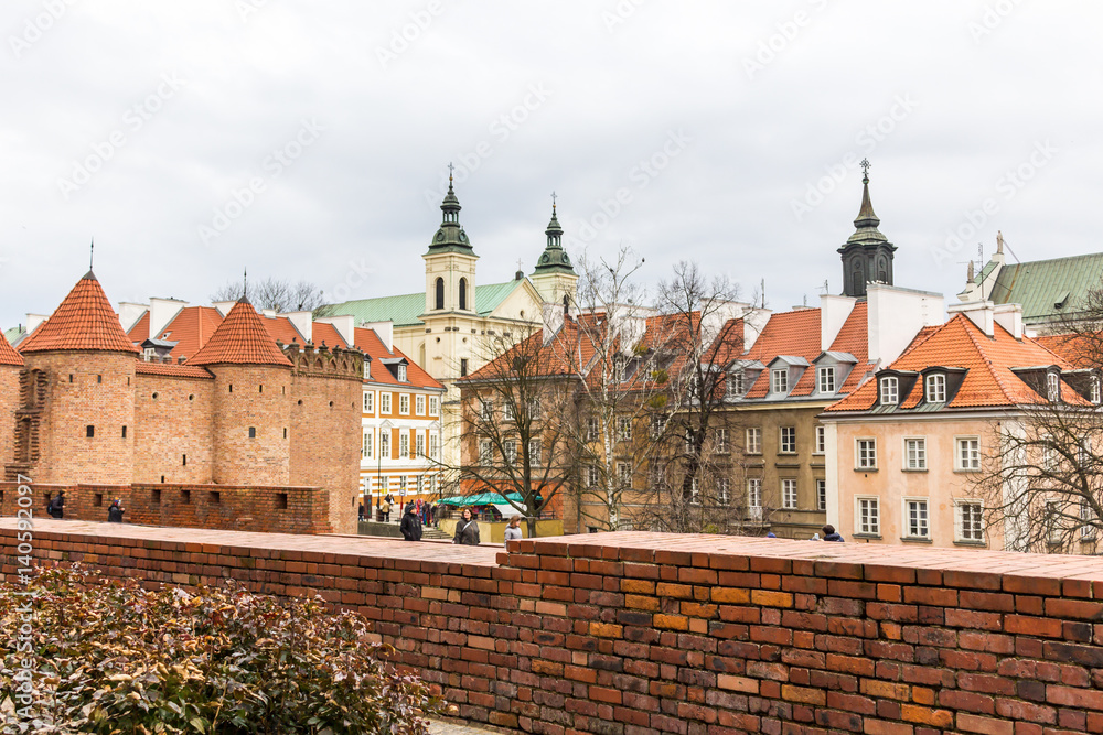 The area of the Old Town in Warsaw, Poland . Medieval houses and towers of churches.