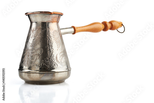 Cooper jezve with wooden handle for Turkish coffee isolated on white background