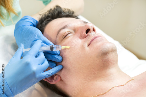 Man passes a course of mesotherapy clinic 