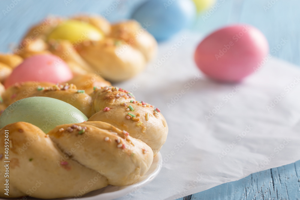 Easter sweet bread with multicolored eggs Easter sweet bread with multicolored eggs