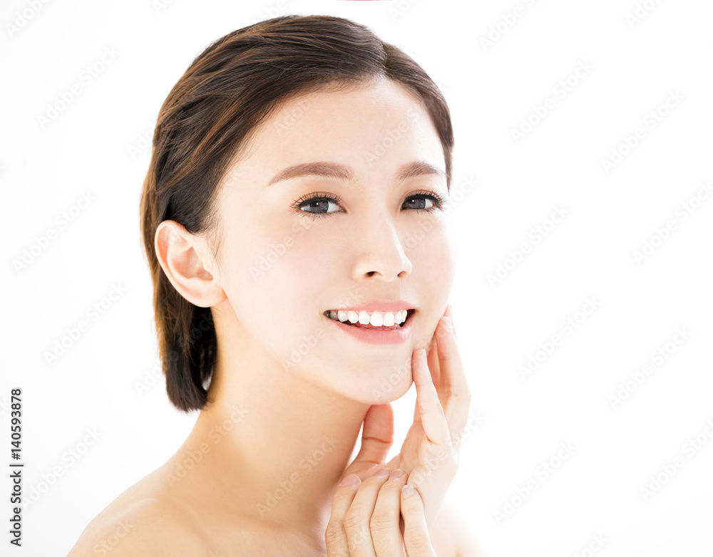 closeup   young  smiling woman face isolated on white